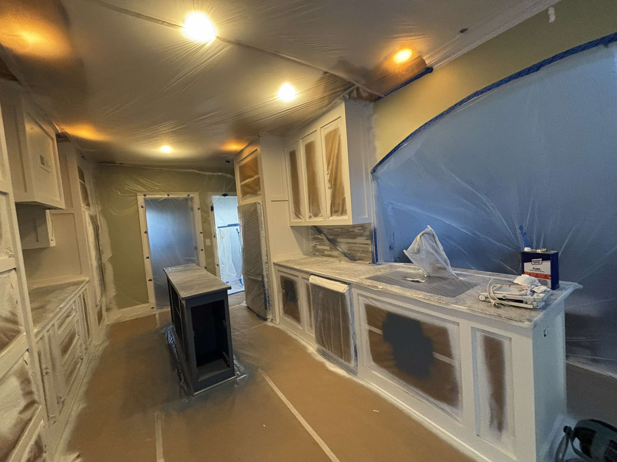 Interior work area carefully protected during surface preparation